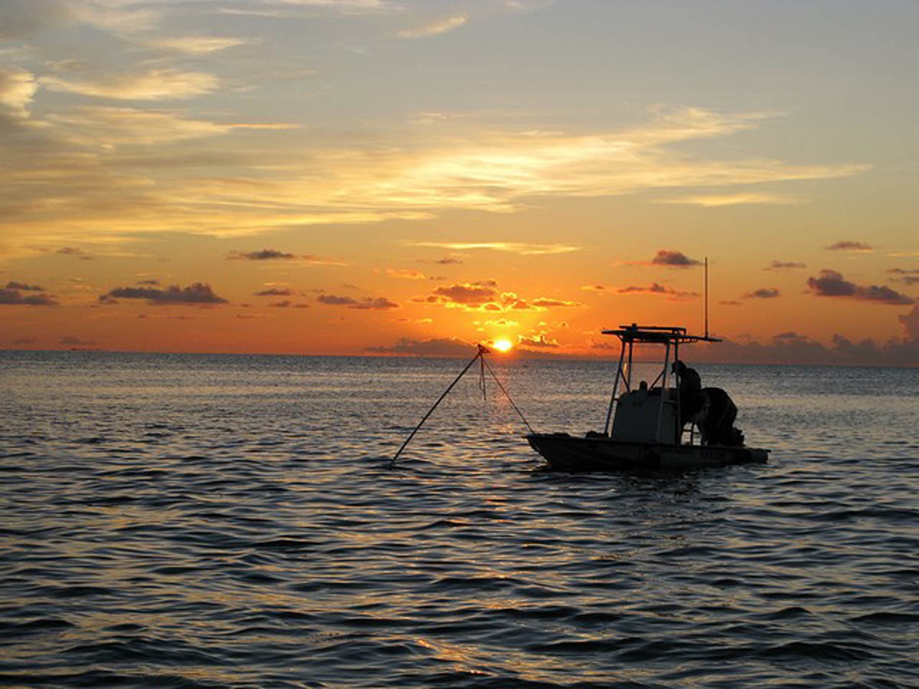 Boat at sunset on the Gulf of Mexico near Naples, Florida
