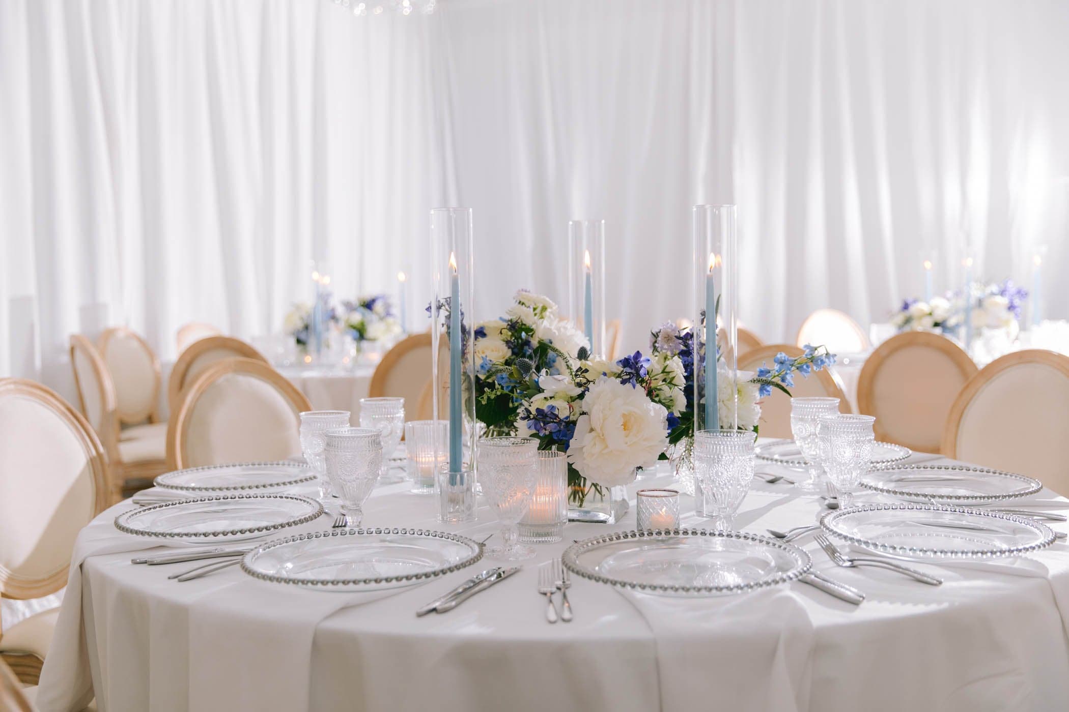 Wedding reception table with candles and glassware at Inn on Fifth, Naples FL