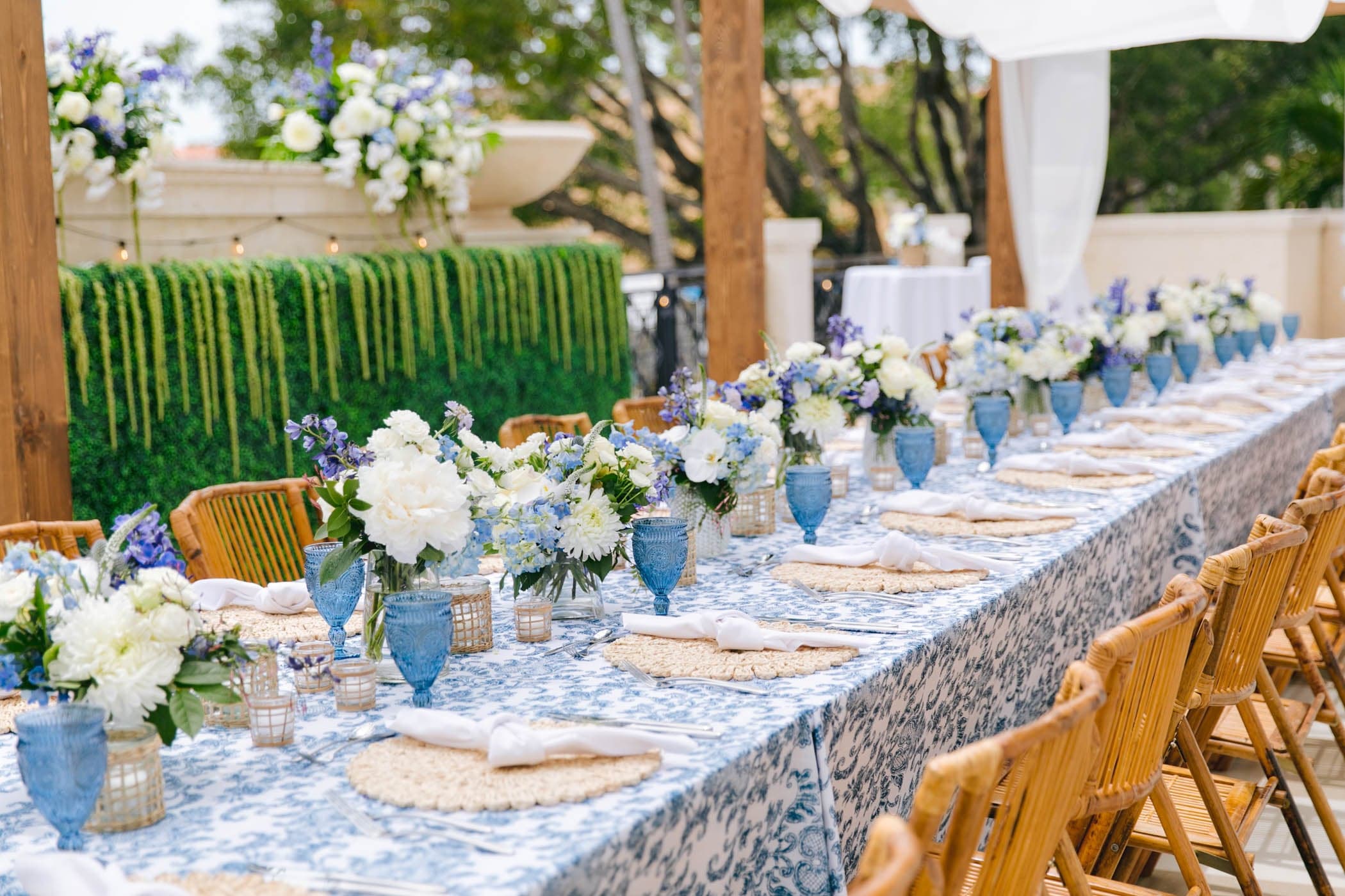 Outdoor banquet table with floral centerpieces at Inn on Fifth in Naples, FL