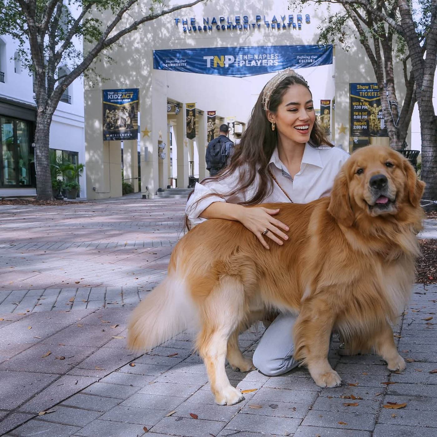 A woman holding a dog