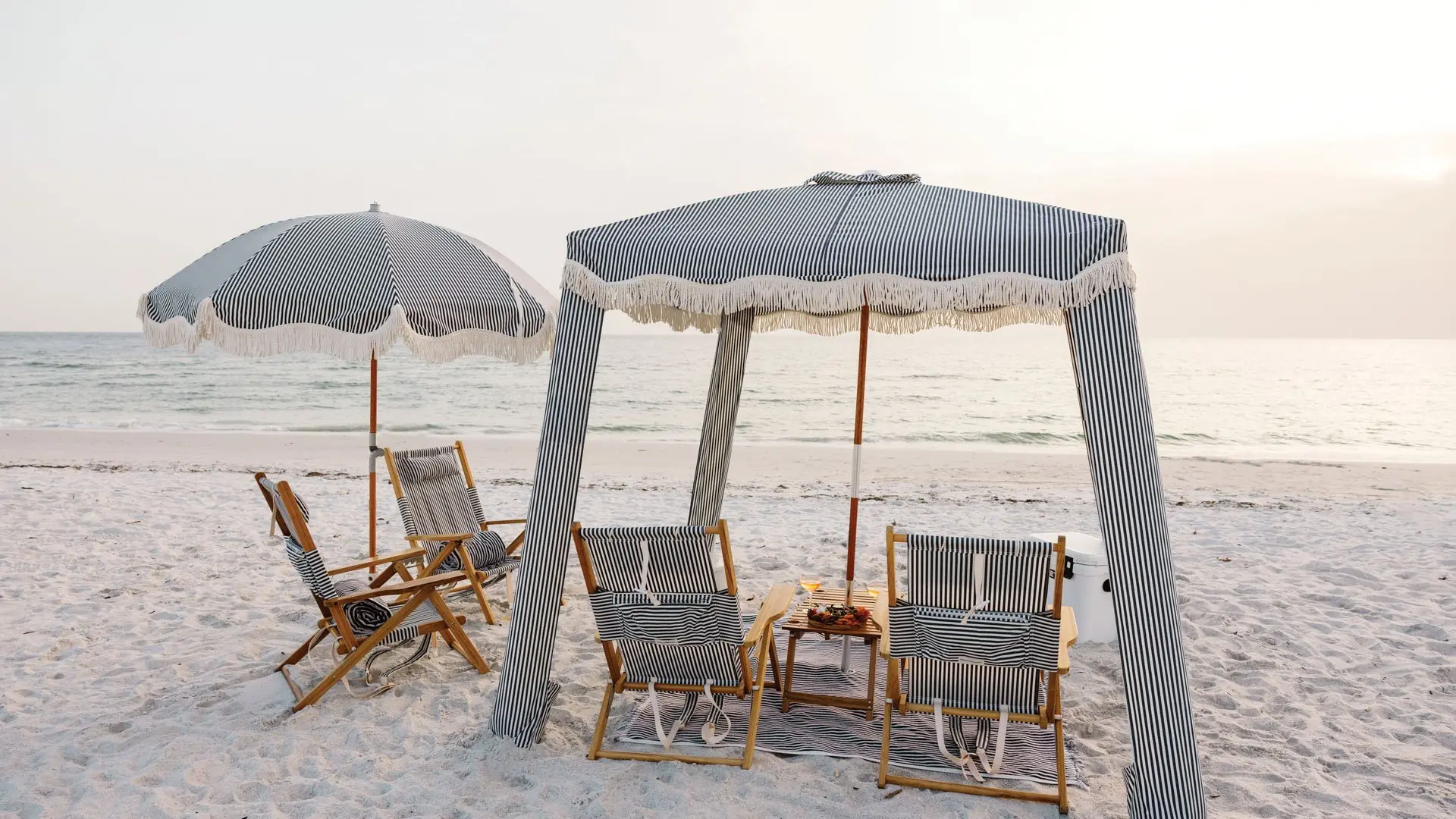 Beach cabana with loungers at the Inn on Fifth beach club in Naples, Florida