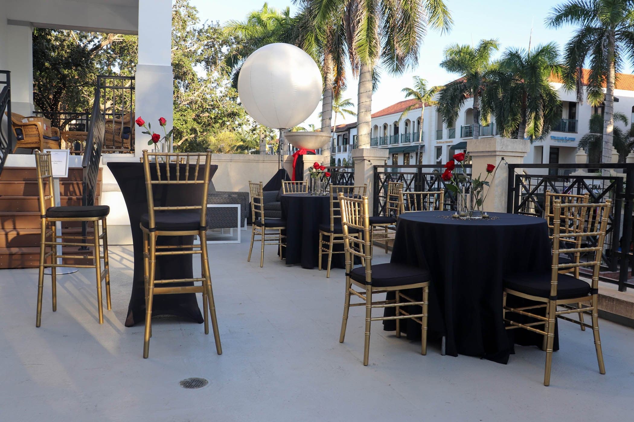 Outdoor cocktail reception with high-top tables at Inn on Fifth in Naples, FL