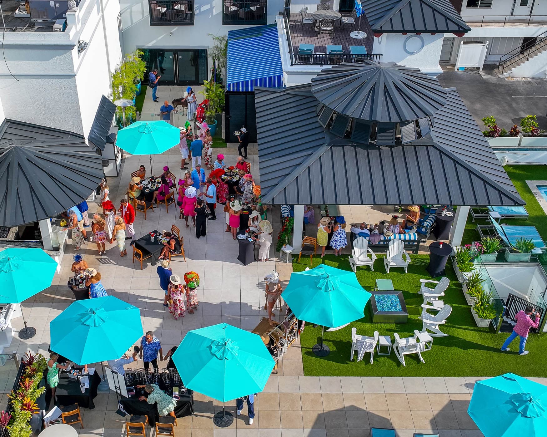 Outdoor event with teal umbrellas at Inn on Fifth in Naples, Florida