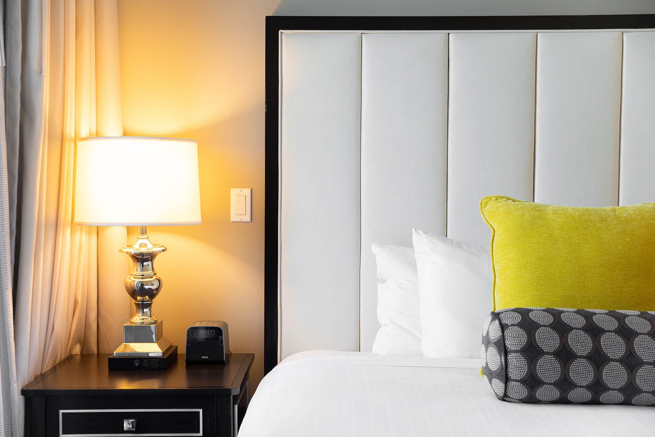 A close up on a bed and side table at Inn on Fifth