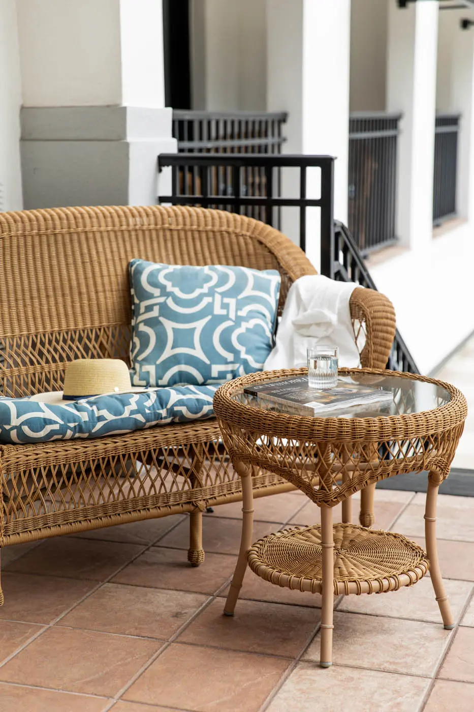 A wicker patio set on a patio of a room at Inn on Fifth