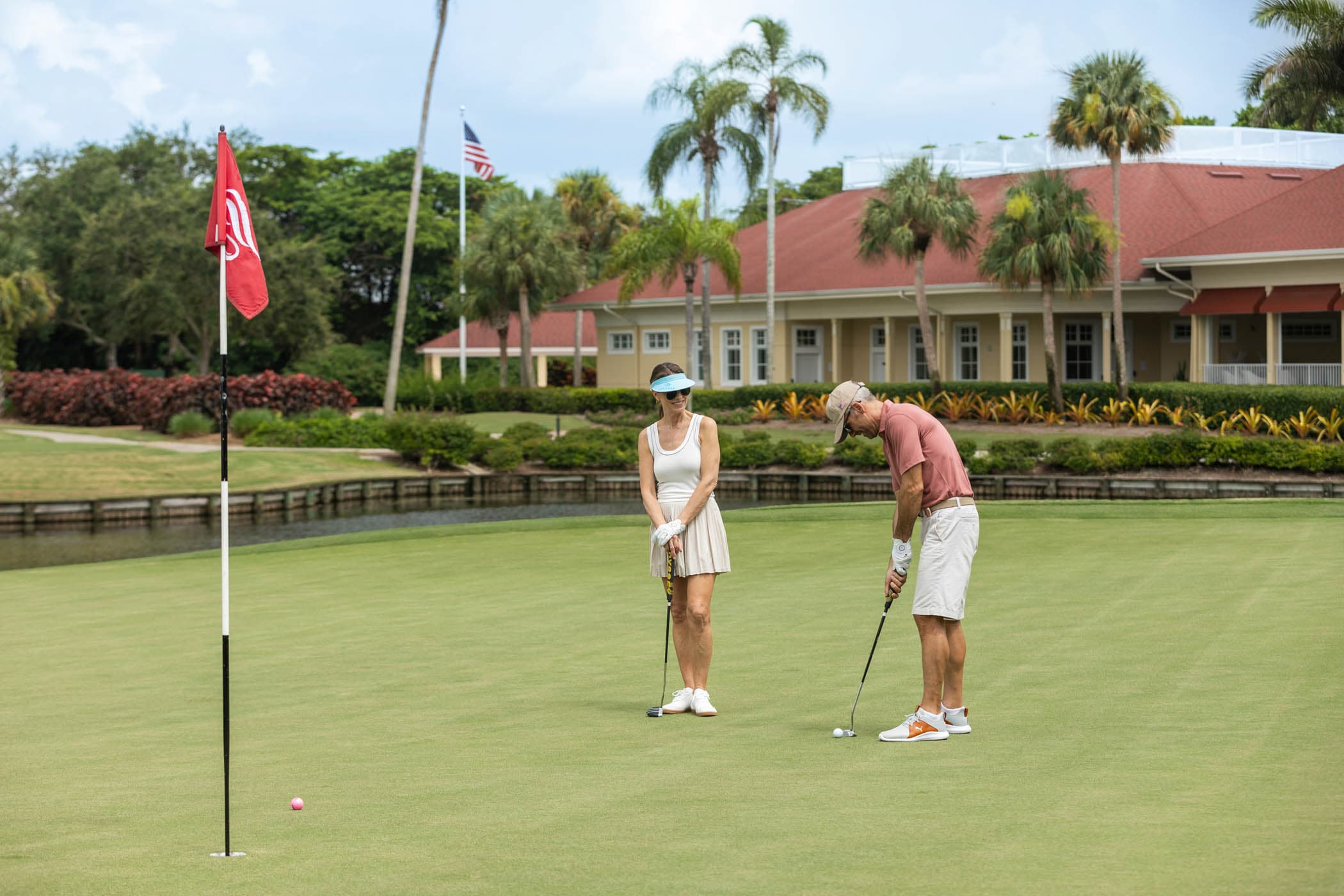 Golfers putting on a green at a Naples, Florida country club
