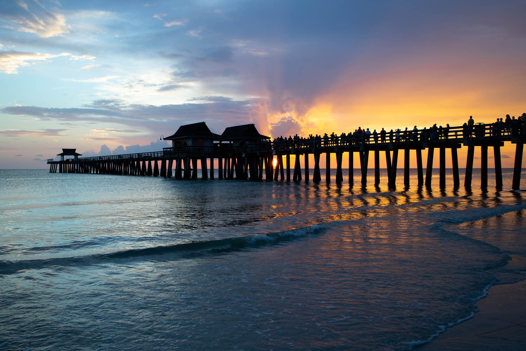 Naples Pier at sunset over the Gulf of Mexico in Naples, Florida