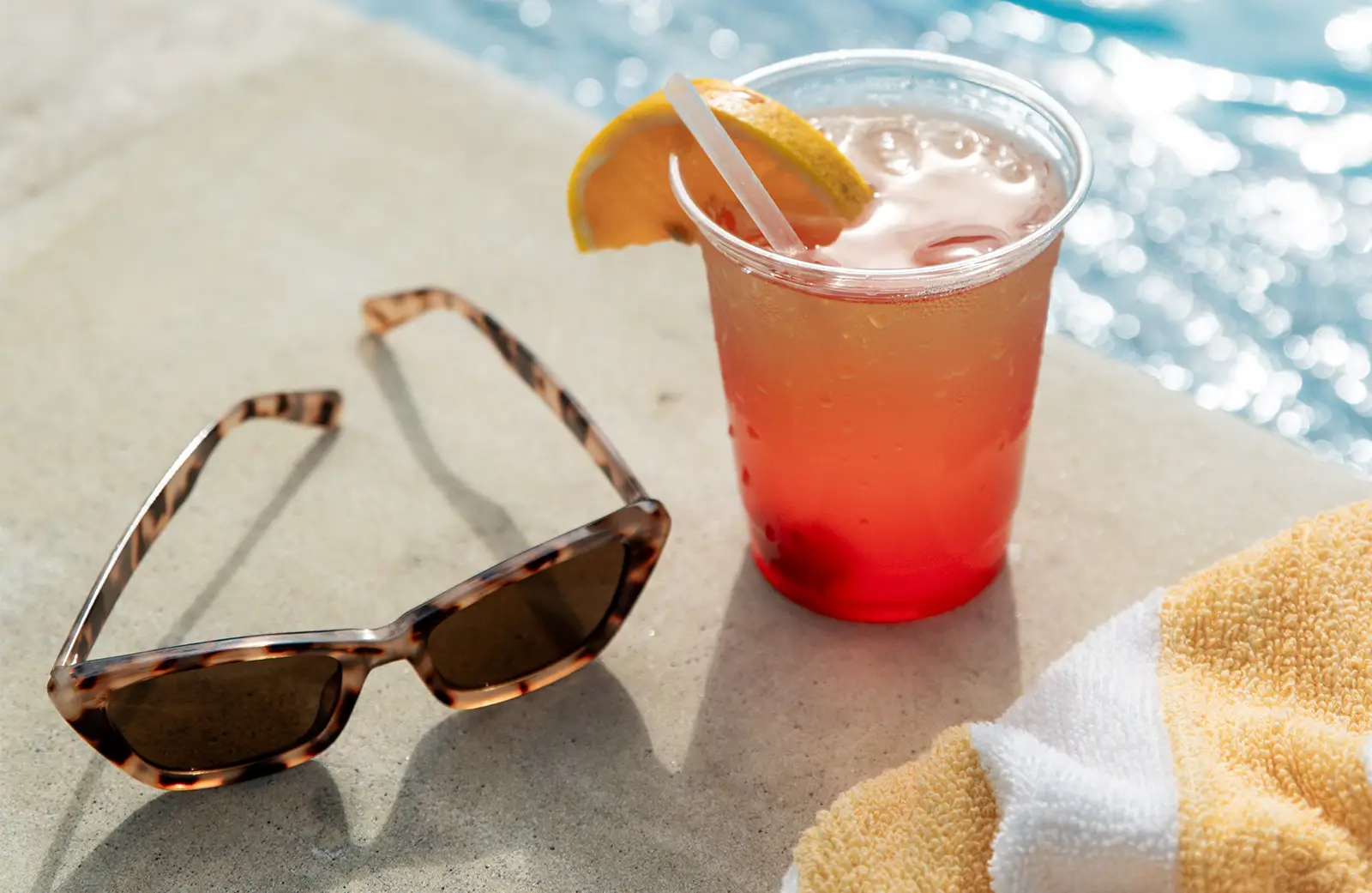 Drink and glasses by pool