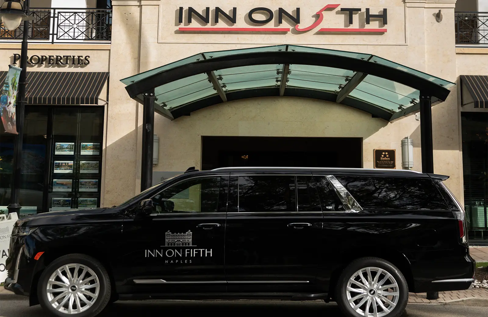 Exterior of hotels with Inn on Fifth SUV
